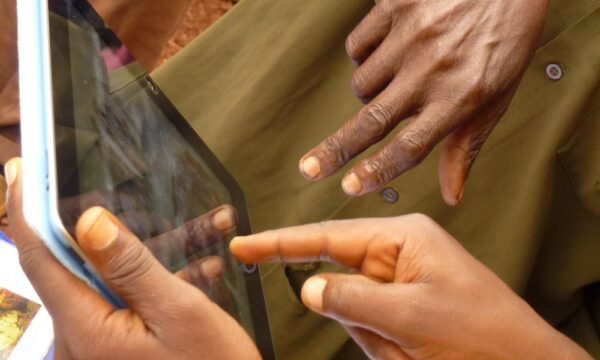 "town of Kyatsaba in Beni, North Kivu Province of DRC. In P1110488, the man on the right is the plant clinic coordinator Patrick Simbalalya showing the symptoms of cocoa black pod (Phytophthora palmivora) to a couple of farmers during a plant health rally town of Kyatsaba in Beni, North Kivu Province of DRC. In P1110488, the man on the right is the plant clinic coordinator Patrick Simbalalya showing the symptoms of cocoa black pod (Phytophthora palmivora) to a couple of farmers during a plant health rally"